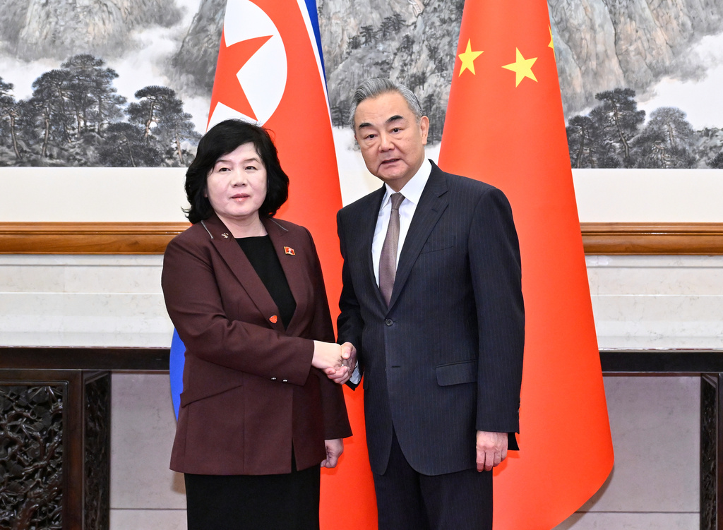 Chinese Foreign Minister Wang Yi, right, shakes hands with visiting North Korean counterpart Choe Son Hui prior to a meeting, in Beijing. (Xinhua via AP)